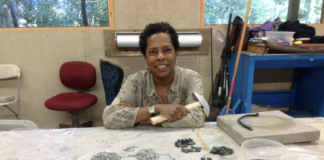 The artist Wasentha Young with her artistic materials.