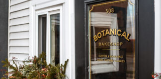 foor of bakery against white siding