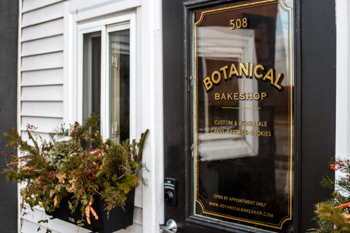 foor of bakery against white siding