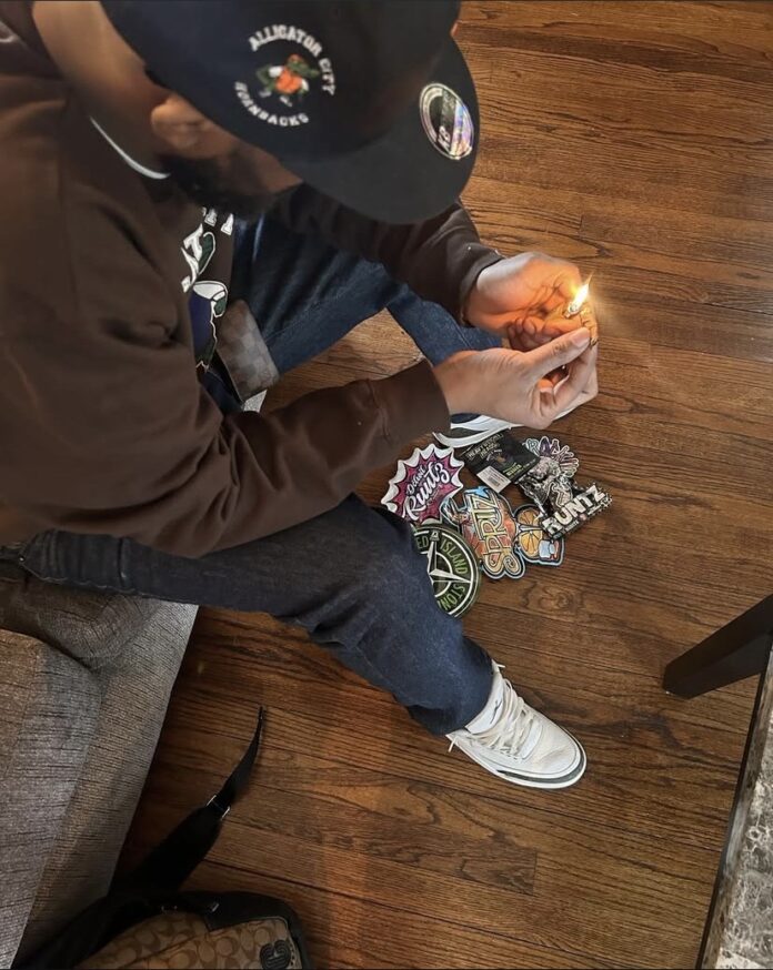Man lighting up to smoke cannabis