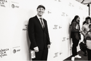 Davy Rothbart on red carpet in a black and white photo 