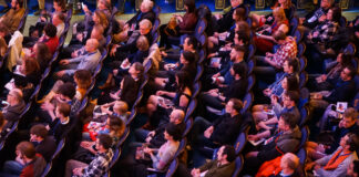 theater-goers in seats