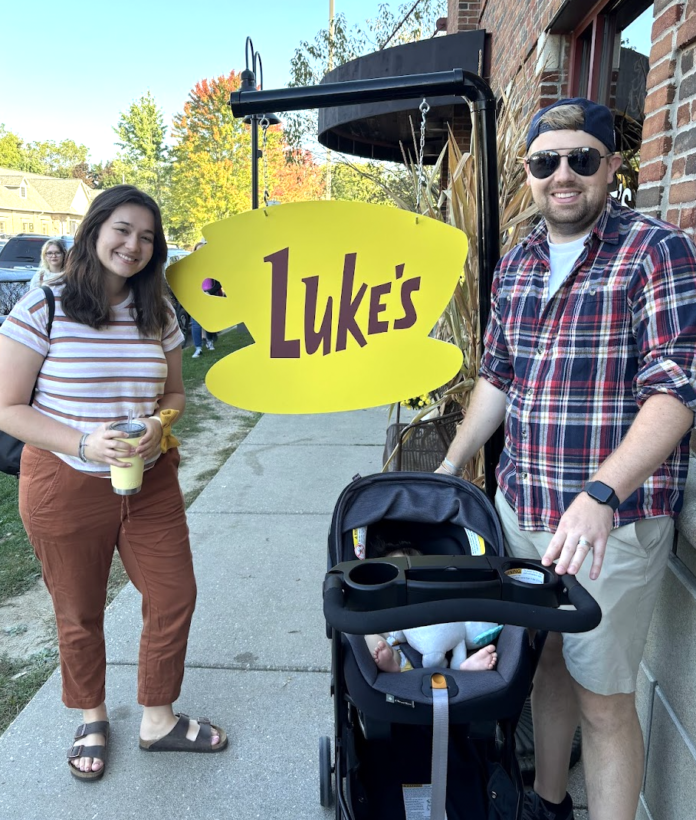 Assignment editor, Mary, with husband and baby in front of 