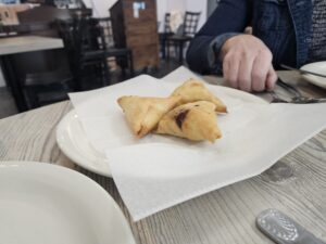 Vegetable samosas come in three. Photo by Drew Saunders.