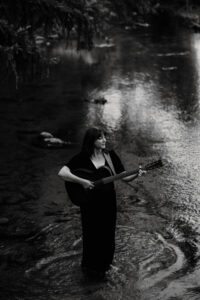 Rochelle Clark with her guitar, provided by via Catalyst Media Factory. Photo taken by Courtney Trudo.