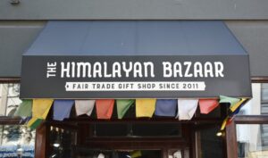 The Himalayan Bazaar's sign that reads "fair trade gift shop since 2011."