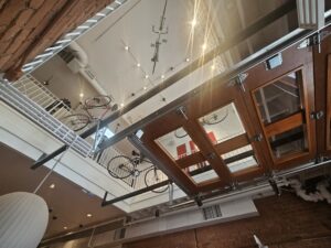 Bicycles get suspended from the ceiling over the main room of Corrati's. Photo by Drew Saunders
