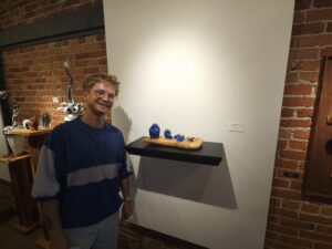 Jacob Nordin with one of his premier show pieces, "Crystal # 6/Crop #2." Photo by Drew Saunders