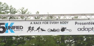 Massachusetts AdaptX Unified 5K 2025 inclusive road race double amputee crosses finish line