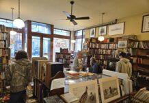 The front room of West Side Books peopled. Photo by Drew Saunders.