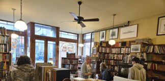 The front room of West Side Books peopled. Photo by Drew Saunders.