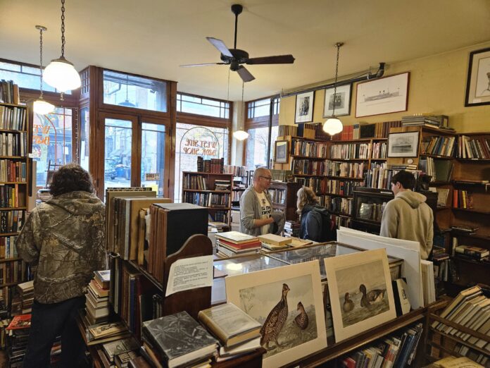 The front room of West Side Books peopled. Photo by Drew Saunders.