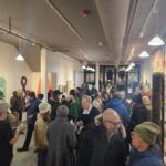 The opening recenption of “Artists and Their Teachers: the Power of Mentorship in the Transfer of Ideas” in the former CultureVerse gallery on Dec. 5. Photo by Drew Saunders.