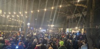 The poetry vigil to remember Renee Good and protests the immigration policy and behavior of the Trump Administration on Friday rivaled that of some of the Sonic Lunch concerts that happen in that same park every summer. Photo by Drew Saunders.