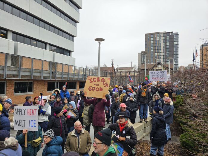The crowd remembering Renee Nichole Good and protesting the Trump Administration's behavior to immigrants, racial minorities, and the rule of law, in front of Ann Arbor City Hall. Photo by Drew Saunders.