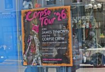 The Corpse Tour '26 poster in the front window of Vault of Midnight. Photo by Drew Saunders.