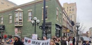 A2 Against Ice took Sunday's protest past Literati. Photo by Drew Saunders.