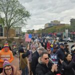 Crowd at the May Day resource rally held by A2 Indivisible. Photo by Drew Saunders.