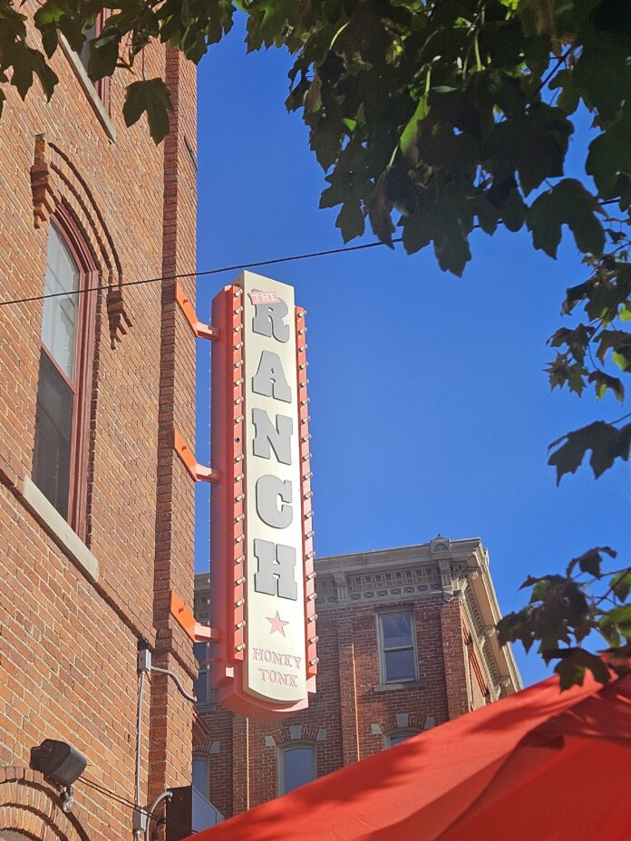 The Ranch Honky Tonk sign above the corner of Washington and Ashley. Photo by Drew Saunders.