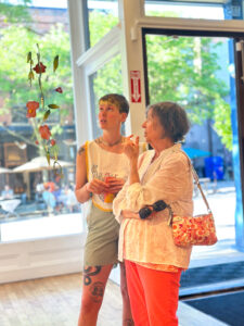Quinn Faylor and a guest at the opening reception of How We Hold. Photo provided by the Ann Arbor Arts Center.